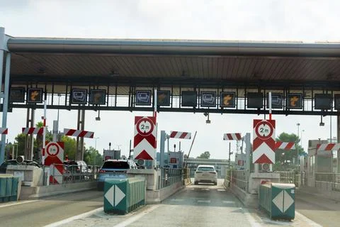 Close view of vehicles passing through toll lanes Stock Photos