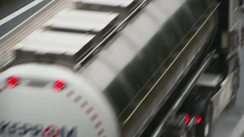 Close up view of vehicles passing by on wet highway road Stock Footage 164686088