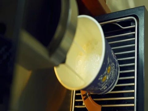 Close up view of vending machine pouring coffee into cup. Stock Footage 79990473