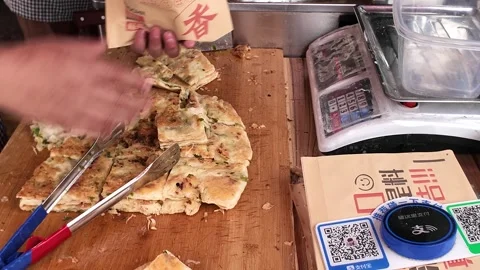 Close View of Vendor Cutting Scallion Pancake in Shanghai Stock Footage 340176843