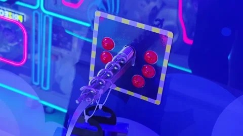 Close-up view of a vibrant game control panel featuring a metallic spring-loaded Stock Footage 341657694