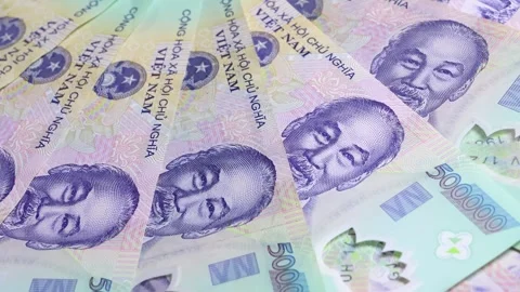 Close up view of Vietnamese dong banknotes with slow rotation Stock Footage 304693643