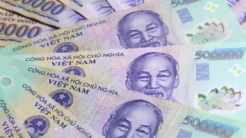 Close up view of Vietnamese dong banknotes with slow rotation Stock Footage 304693674