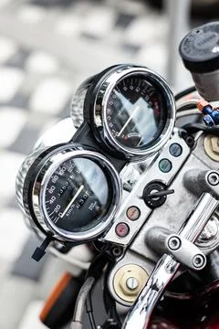 Close up view view over the handlebars of motorcycle, speedometer. Stock Photos