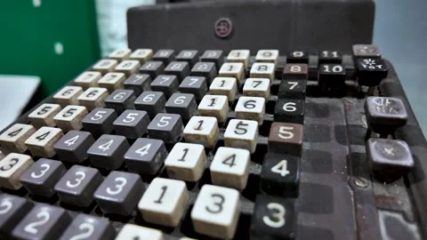 A close-up view of a vintage Burroughs mechanical adding machine, highlighting Stock Footage 339413747