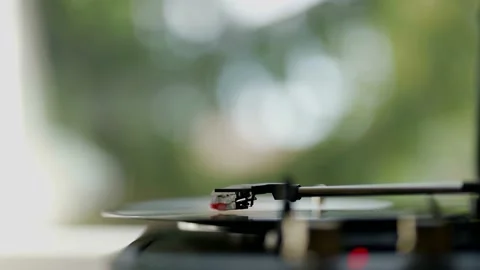 Close-up view of a vinyl record spinning on a vintage turntable, slow motion Stock-Footage 164035254