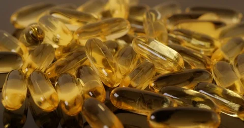 Close up view: Vitamins supplements pills omega 3. Fish oil capsules. 4k. 50fps Stockbeeldmateriaal 108100721