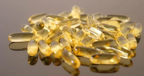 Close up view: Vitamins supplements pills omega 3. Fish oil capsules. 4k. 50fps Stockbeeldmateriaal 108101010