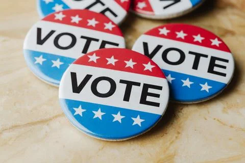 Close view of vote badges on marble background Stock Photos