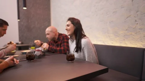 A close-up view, waiter is bringing out burgers to the customer.  Stock Footage 102761096