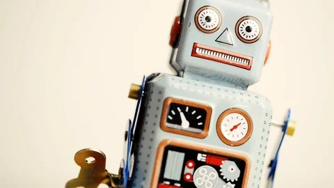 Close-up view of a walking retro wind-up Robot toy Stock Footage 122479385