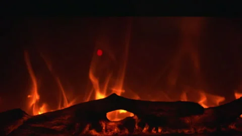 Close up view of warm orange fireplace flames flickering Stock Footage 321769509
