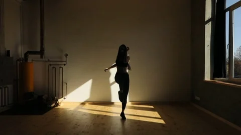 Close-up view of the warming up of the sportwoman. She is jogging and jumping in Stock Footage