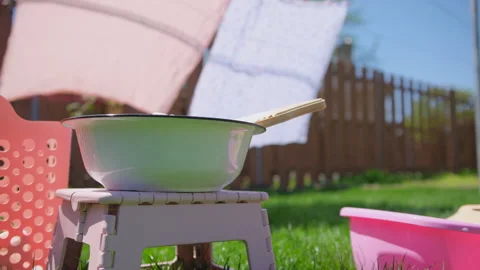 Close up view of Washing clothes on old vintage washboard outdoors. Stock Footage 274508921