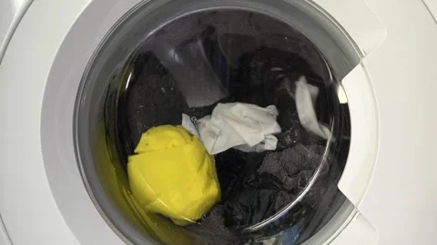 Close up view of a Washing Machine in Action Spinning Laundry Load Stock Footage 294107725