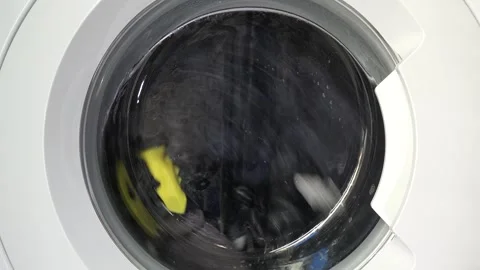 Close up view of a Washing Machine in Action Spinning Laundry Load Stock Footage 294108179