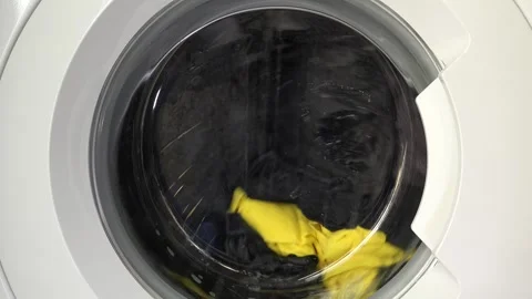 Close up view of a Washing Machine in Action Spinning Laundry Load Stock Footage 294108596