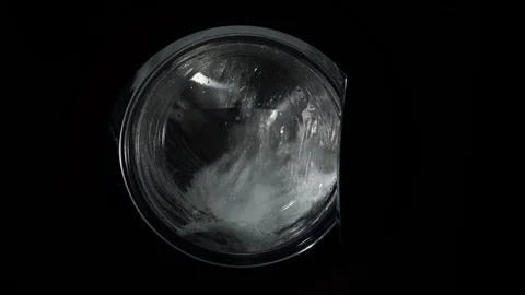 Close up view. The washing machine on a black, dark background. Spinning drum Stock Footage 122571537