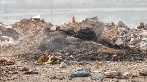 Close view of waste burning on top of hill Stock Footage 151939458