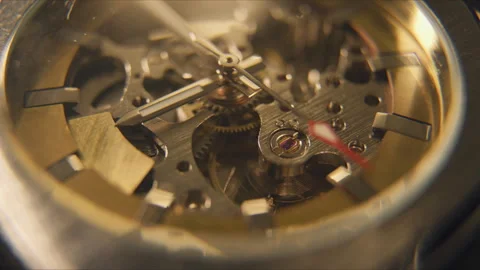Close view of watch movement showing gears, hands, and mechanisms in action Stock Footage 336224291