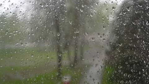 Close up view of water drops falling on glass. Rainy season autumn. Raindrops Stock Footage 194503306