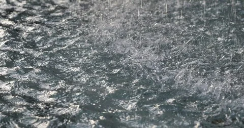 Close up view, water drops  onto pool or pond. Stock Footage 117869015