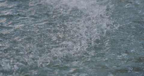 Close up view, water drops  onto pool or pond. Stock Footage 117869017