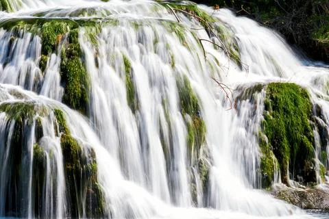 Close up view to water stream in the fast waterfall Stock Photos