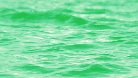 Close up view of water surface and small waves on green screen background Stock Footage 313517427
