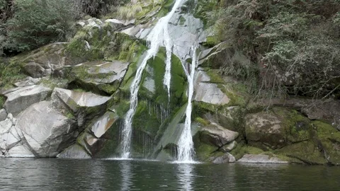 Close view of a waterfall at its bottom. Handheld record.  Stock Footage 125096454