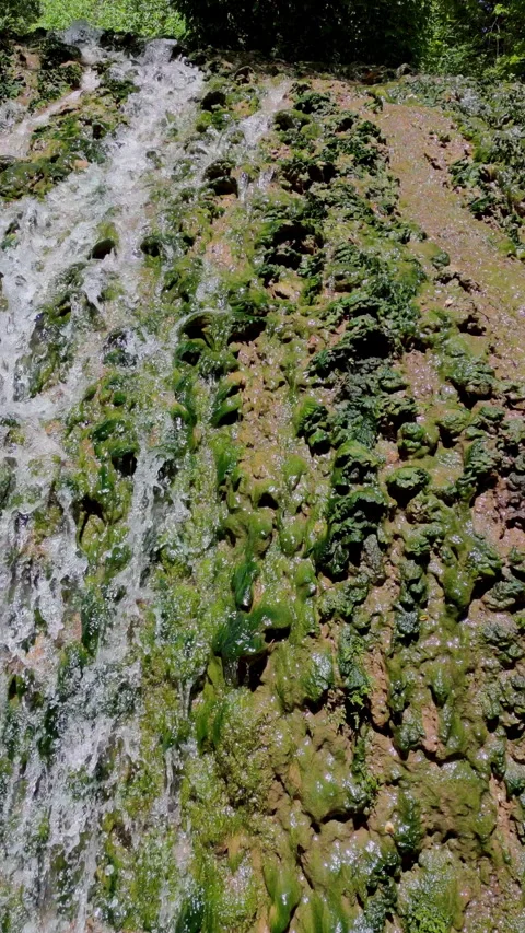 Close Up view waterfall in vertical format. 4k resolution. Video stock 303512120