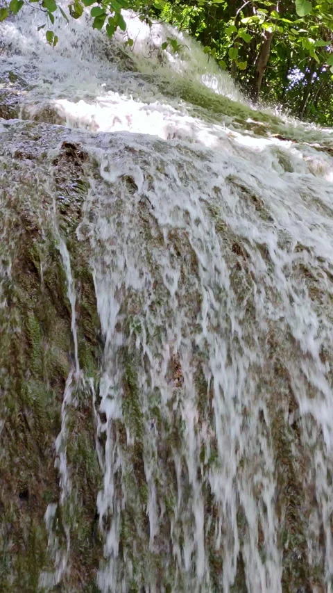 Close Up view waterfall in vertical format. 4k resolution. Video stock 303513397
