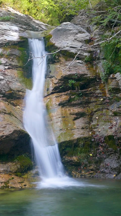 Close-up view of a waterfall in vertical format. Silk effect. Stock Footage 308403986