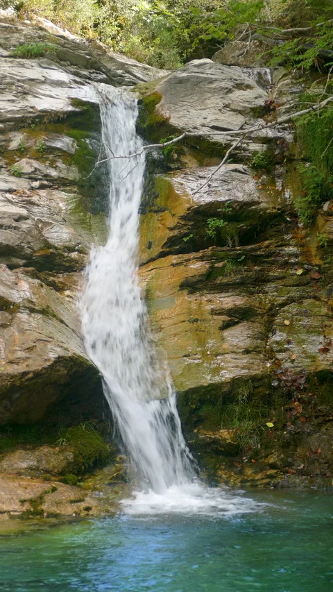 Close-up view of a waterfall in vertical format.4k resolution. Stock Footage 308403875