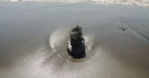 Close view of waves against rock pile. Stock Footage 119962438
