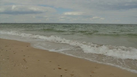 Close view waves break on white sand beach. Sea waves on the beautiful beach Video stock 103356140