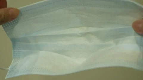 Close-up view of wearing a face mask. 库存影片 145492951