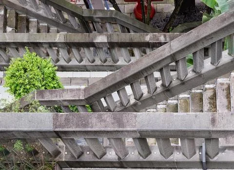 Close-up view of weathered gray concrete stairs and brutalist-style balustr.. Stock Photos