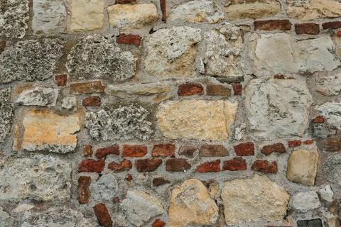 Close view of weathered stone and red brick masonry at Belgrade Fortress. H.. Stock Photos