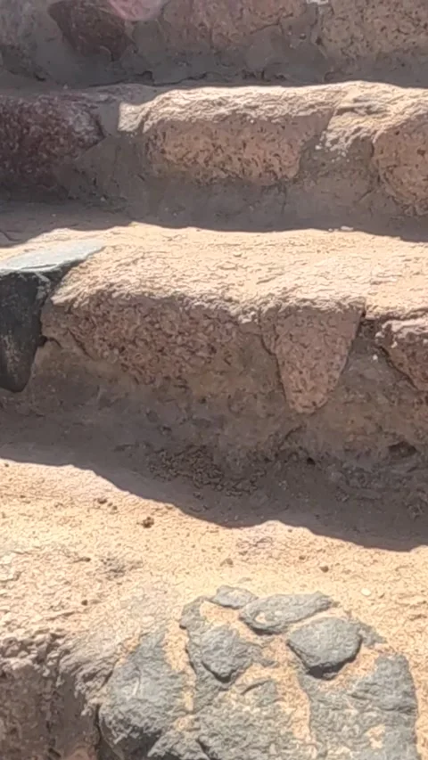 A Close-Up View of Weathered Stone Steps Under Natural Light, Highlighting the Stock Footage 330095805