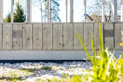 Close view of weathered timber and glass on a greenhouse base Stock Photos