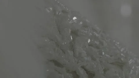 A close-up view of a wedding dress, showcasing its design elements with Video stock 314059378