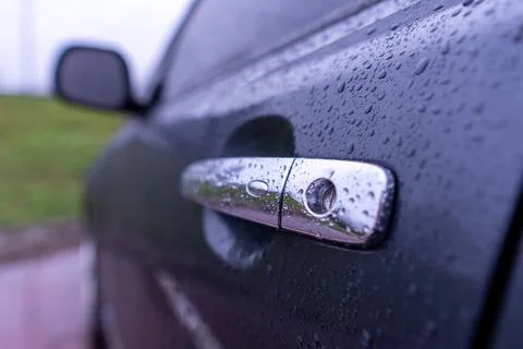 Close View of a Wet Car Handle With Raindrops on a Rainy Day in a Parking L.. Stock Photos