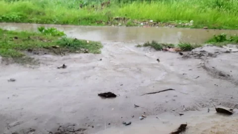 Close up view of a wet road due to heavy rain taken from a high angle Video stock 295887316