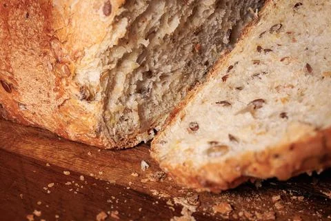 Close-up view of wheat bread with seeds and golden crust Stock Photos