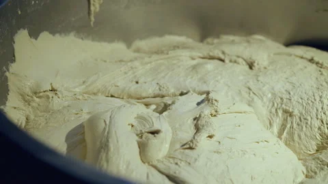 Close view of wheat dough in an automatic kneader. Equipment process on bakery 스톡 동영상 145058485
