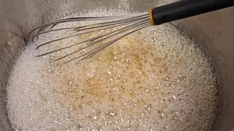 Close up view of whisk mixing boiling caramel Stock Footage 314121185