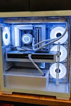 Close-up view of a white computer tower case with glass sides, showcasing int Stock Photos