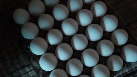 Close Up View of White Eggs Arranged in a Plaid Grid Pattern Inside a Stacking T Vídeo Stock 344036917
