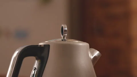 Close-up view of white electric kettle with boiling water and steam 動画素材 231339736